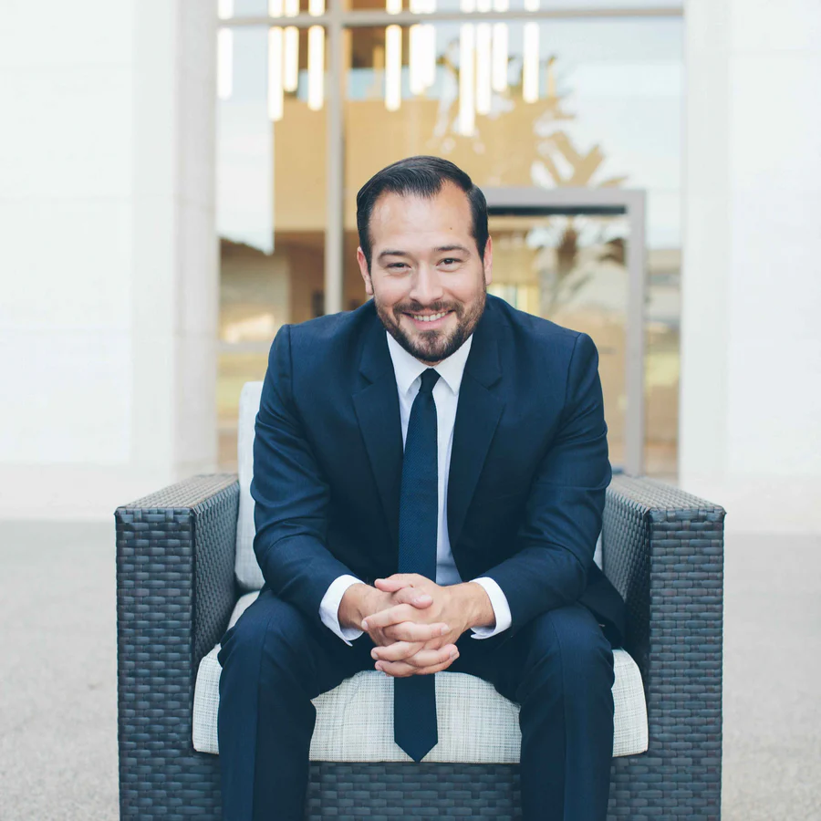 Jesse Melendrez, workers’ compensation attorney, seated in an office lobby